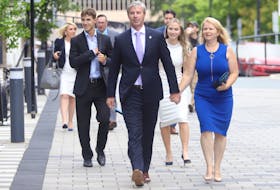 Tim Houston and his family - wife Carol, and children Zachary and Paget - arrive at the Halifax Convention Centre on Tuesday, Aug. 31, 2021, where he will be sworn in as Nova Scotia's new premier, along with other members of his first cabinet.
