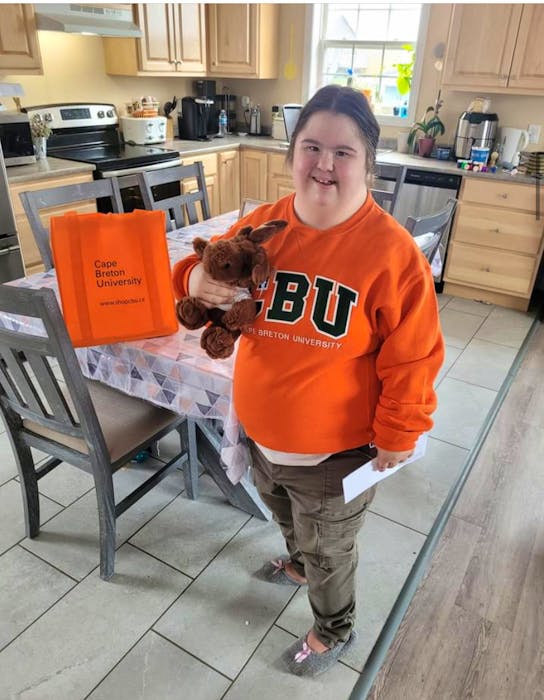 Joanna Paul shows off some of the Cape Breton University swag she received along with $500 as the Sharon Morrison Memorial Award recipient. Paul is excited to start classes at CBU in the fall through CBU's inclusion program. CONTRIBUTED