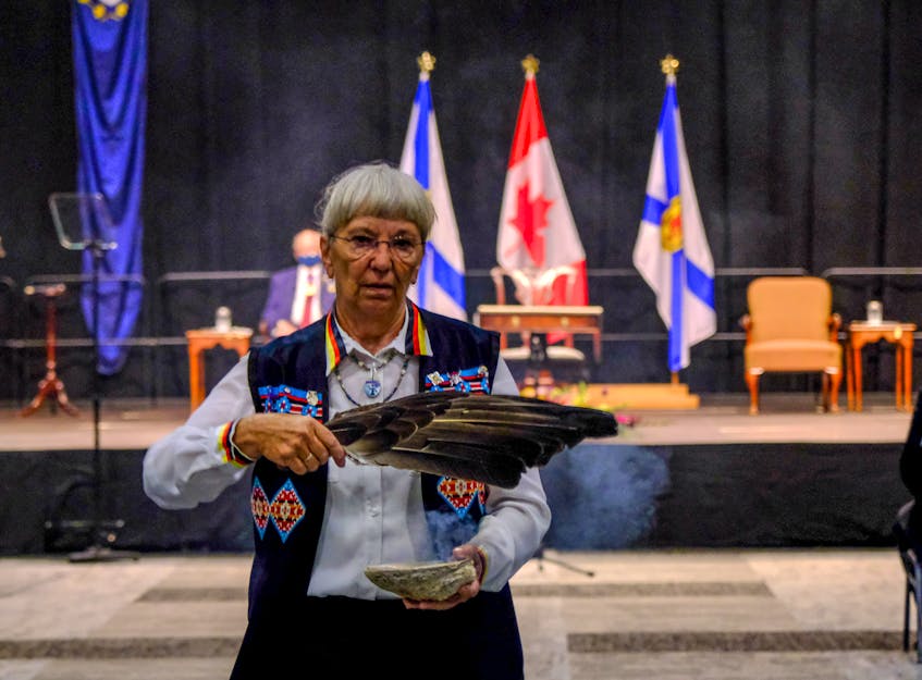 Mi'kmaq elder Marlene Companion conducts a smudging ceremony prior to the swearing-in ceremony. -- TIM KROCHAK PHOTO