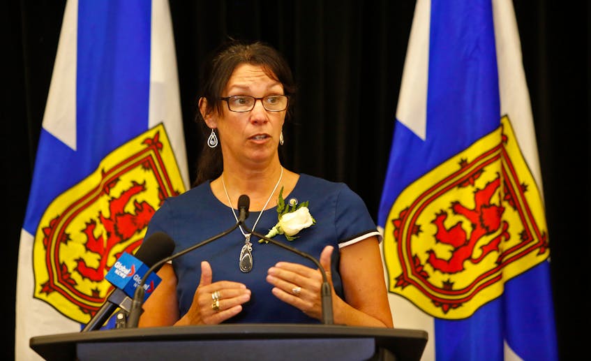 Michelle Thompson, the new health and wellness minister, speaks to media following a swearing-in ceremony for the new Nova Scotia government at the Halifax Convention Centre on Tuesday. -- TIM KROCHAK PHOTO 