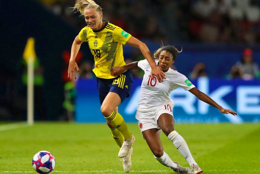 Fridolina Rolfo of Sweden is challenged by Ashley Lawrence of Canada during the 2019 FIFA Women's World Cup France Round Of 16 match between Sweden and Canada at Parc des Princes on June 24, 2019 in Paris, France. 