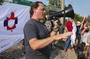  Mark Weber, national president of the Customs and Immigration Union participates in a rally near the Ambassador Bridge in Windsor on Wednesday, August 4, 2021.