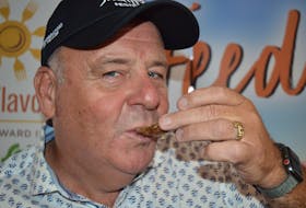 Liam Dolan, the organizer and founder of the P.E.I. International Shellfish Festival, enjoys a fresh oyster at a news conference in Charlottetown to announce details around this year’s event on Aug. 5.