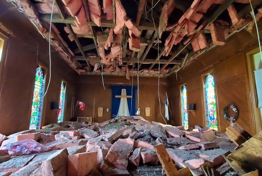 This is a recent photo from inside the sanctuary of the Lot 16 United Church. The 144-year-old house of worship originally had a plaster ceiling, but it was replaced with hardwood a few years after construction was completed. Both ceilings collapsed without warning in early July, and the congregation has been holding services at the local hall ever since. 