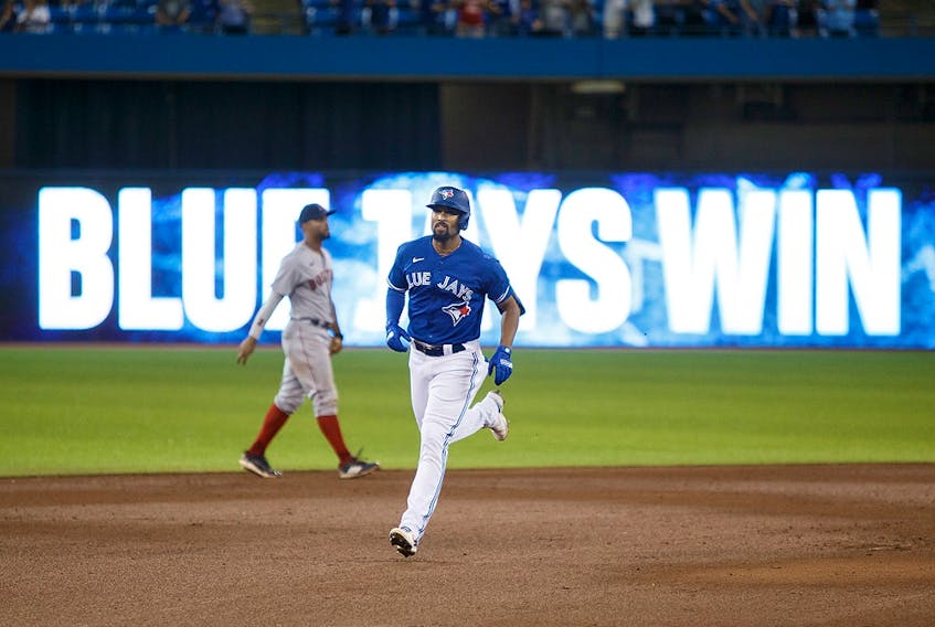 Marcus Semien of the Toronto Blue Jays rounds the bases after he hit a walk-off home run against the Boston Red Sox at Rogers Centre on August 7, 2021. 