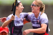 Tokyo 2020 Olympics - Canoe Sprint - Women's C2 500m - Final A - Sea Forest Waterway, Tokyo, Japan – August 7, 2021. Laurence Vincent-Lapointe of Canada and Katharine Vincent of Canada celebrate after winning bronze REUTERS/Yara Nardi