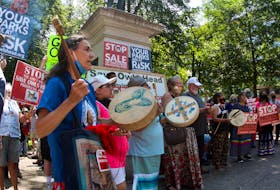 A Mi'kmaw honours song is performed at a rally against the sale of lands in the former Owls Head provincial park in downtown Halifax on Saturday, Aug. 7, 2021.