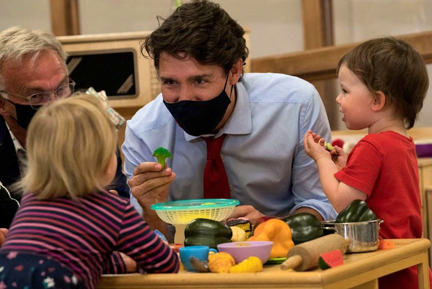 Canada's Prime Minister Justin Trudeau plays with children at the daycare in Carrefour de l'Isle-Saint-Jean school in Charlottetown, Prince Edward Island last month. Ottawa has pledged to give parents access to $10-per-day child care within five years.