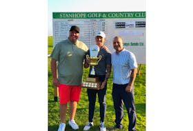 Ben King, left, and Nick Frid, right, congratulate Neal Ryan, the Pro Division and overall winner of the Island Green Podcast-sponsored Stanhope Open. King and Frid co-host the Island Green Podcast along with Len Currie.
