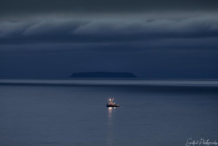 Geralyn Howell sent us this photo of a lobster boat heading out to work the Bay of Fundy off Annapolis Royal, N.S. with majestic Isle Haute and some ominous looking storm clouds in the background. Isle Haute was given its name in 1604 by Samuel de Champlain when he observed its high bluffs, timber and fresh-water springs. Thanks, Geralyn for the photo.