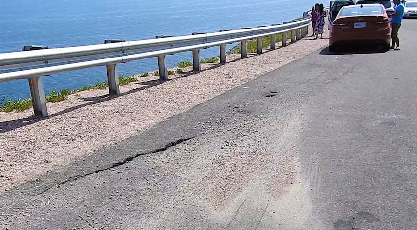 Cracks in the pavement along this portion of the Cabot Trail which goes up Cape Smokey appear to be going down the mountain. CONTRIBUTED
