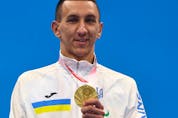 Tokyo 2020 Paralympic gold medalist Denys Dubrov of Ukraine celebrates on the podium, August 28, 2021. 