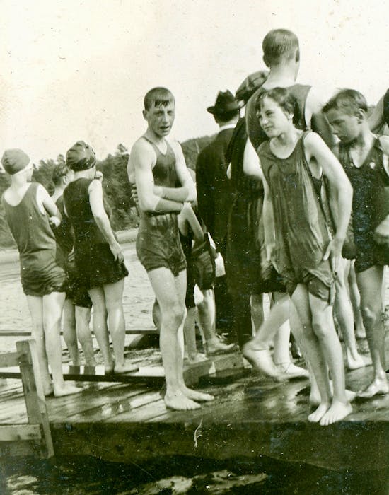 Area children stand on a Nelgah Beach wharf while awaiting their turn to jump into the water. CONTRIBUTED • BEATON INSTITUTE DIGITAL ARCHIVES