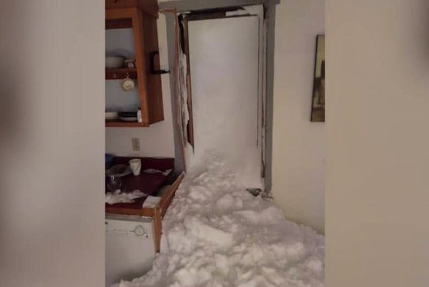 A photo taken after an avalanche burst through the window of a home in The Battery neighbourhood in St. John's during Snowmageddon last year. — Contributed - Contributed