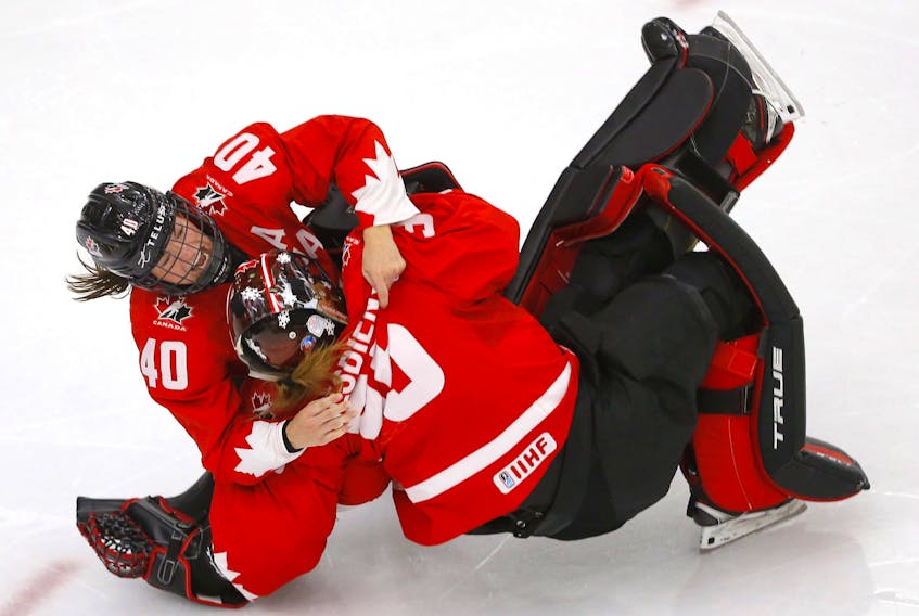 Team Canada beats Team USA in overtime action during the 2021 IIHF Women’s World Championship Gold medal game at the Winsport arena in Calgary on Tuesday, August 31, 2021. 