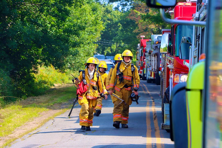 New Minas firefighters make their way to the scene with some necessary equipment.
ADRIAN JOHNSTONE
 - Contributed