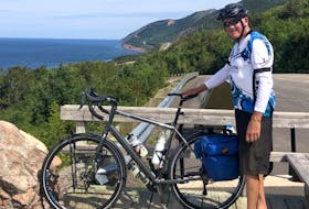 hris MacInnis of Coxheath stopped for a break during his annual bike trip of the Cabot Trail. MacInnis recently completed his 45th trip around the trail, a feat dating back to 1976. CONTRIBUTED • JOHN MACINNIS