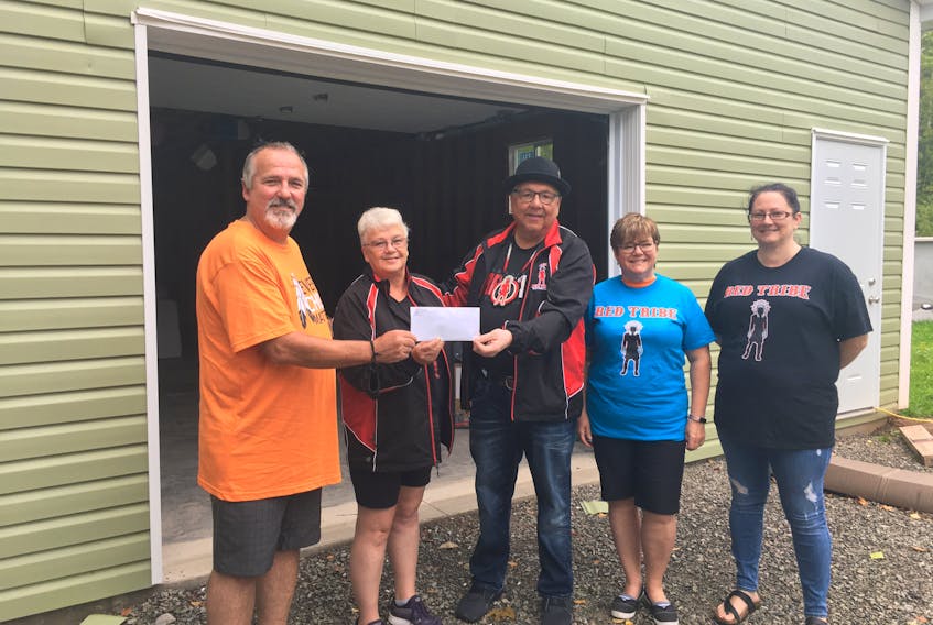 UNIFOR Local 4600 president Jamie Pollock, left, said, "Every child does matter, and we want to make sure that the children are able to grow and advance in their own community." The group made a $500 donation to the Red Tribe Boxing Club in Eskasoni First Nation on Friday. Pictured left to right are: Pollock, Red Tribe's manager Judy MacPhee, club owner Barry Bernard, and UNIFOR members Nelina Seymour and Sabrina McLean. ARDELLE REYNOLDS/CAPE BRETON POST 