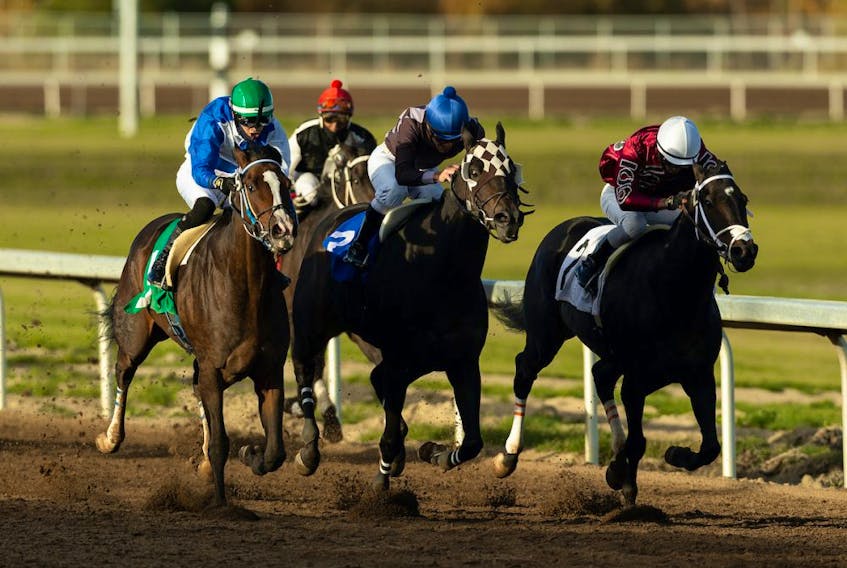Regal Max ridden by Edgar Zenteno (third from right) hits the gas to win the Allowance Optional Claiming race during the 91st Canadian Derby at Century Mile racetrack in Nisku south of Edmonton, on Sunday, Sept. 27, 2020. Real Grace went on to win the Canadian Derby later in the evening. 
