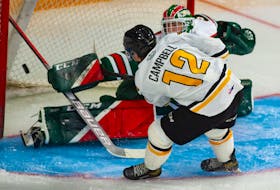 Halifax Mooseheads goalie Brady James makes a save on Cape Breton Eagles centre Jack Campbell during Saturday's QMJHL exhibition game at the Scotiabank Centre.