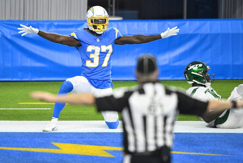 Tevaughn Campbell #37 of the Los Angeles Chargers celebrates after breaking up a pass intended for Denzel Mims #11 of the New York Jets during the second half at SoFi Stadium on November 22, 2020 in Inglewood, California. 