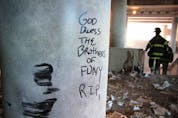  A message is scrawled in ash on a column inside One Financial Center, adjacent to the World Trade Center ruins.