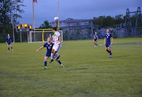 Nathan Chow of the UPEI Panthers jumps in the air to head the ball while closely guarded by the St. Francis Xavier X-Men’s Logan Harrington, 17, during the first half of an Atlantic University Sport men’s soccer match at UPEI on Sept. 10. The X-Men defeated the Panthers 2-1.