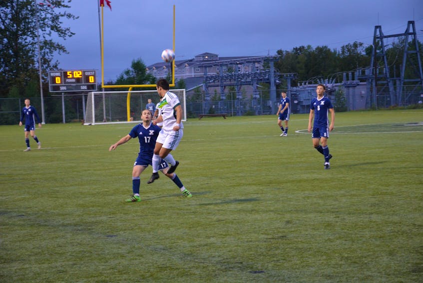 Nathan Chow of the UPEI Panthers jumps in the air to head the ball while closely guarded by the St. Francis Xavier X-Men’s Logan Harrington, 17, during the first half of an Atlantic University Sport men’s soccer match at UPEI on Sept. 10. The X-Men defeated the Panthers 2-1.