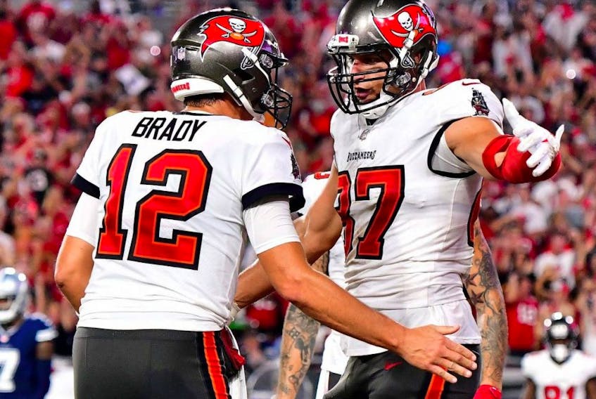 Tom Brady (left) and Rob Gronkowski of the Tampa Bay Buccaneers celebrate a touchdown during their team's 31-29 win over the Dallas Cowboys at Raymond James Stadium on Sept. 9, 2021 in Tampa, Fla.

