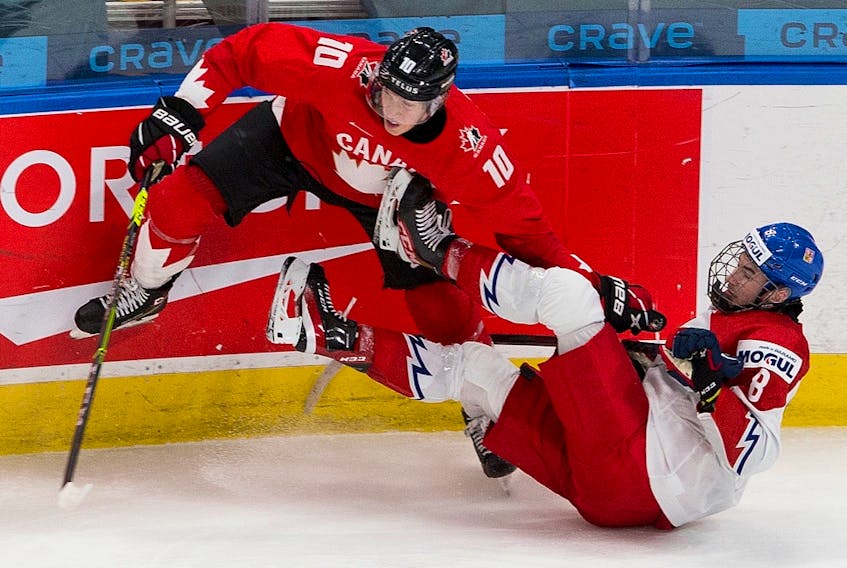 Canada's Dylan Holloway (10) upends Czech Republic's David Jiricek (8) in their IIHF world junior championship quarter-final on Jan. 2, 2021 in Edmonton.