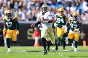  Jameis Winston of the New Orleans Saints carries the ball against the Green Bay Packers during the first quarter at TIAA Bank Field on September 12, 2021 in Jacksonville, Florida. (Photo by Sam Greenwood/Getty Images)