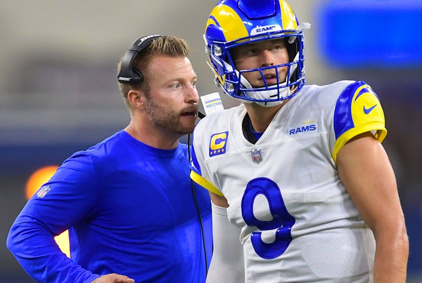 Rams head coach Sean McVay talks with quarterback Matthew Stafford (9) during a time out in the fourth quarter of the game against the Chicago Bears at SoFi Stadium.
