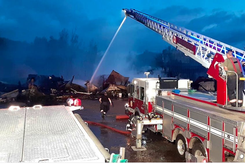 Volunteer firefighters spent about six hours knocking down an early Saturday morning fire at the Northside Auto Salvage on Tobin Road in North Sydney. CONTRIBUTED • NORTH SYDNEY FIRE AND RESCUE