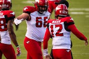  Calgary Stampeders’ Jake Maier (12) celebrates a touchdown with teammates on the Edmonton Elks during second half CFL football action at Commonwealth Stadium in Edmonton, on Saturday, Sept. 11, 2021.