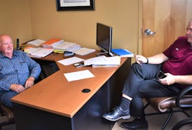 Stu Rath and Dave Higgins recently going over school arrangements for players already signed for the Truro Jr. A Bearcats 2021-22 team.