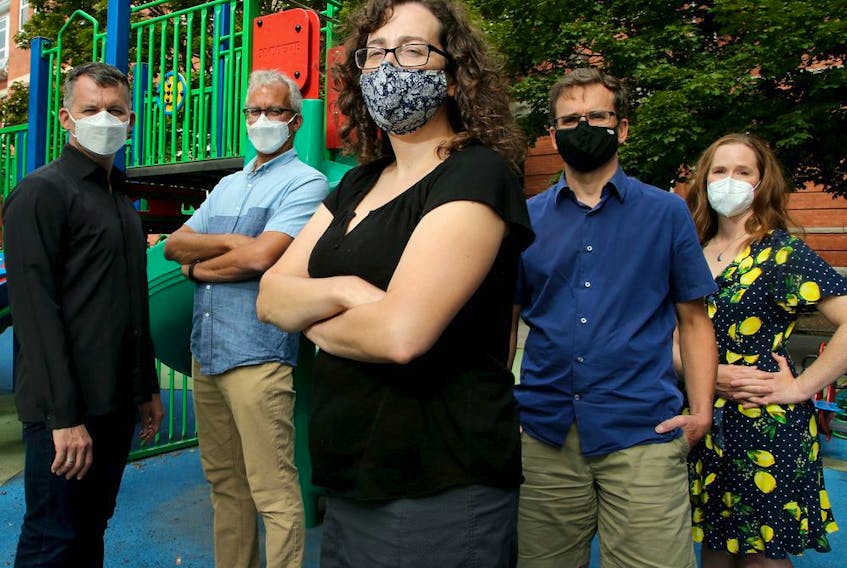 Mindy Sichel (centre) and her husband Kevin Neden (centre right), along with Joël Beddows (far left) and his husband Lawrence Aronovitch and another parent and family doctor, Shoshanah Deaton (far right) are just some of the parents of kids at Francojeunesse School in Sandy Hill that plan to keep their kids home on Election Day. 