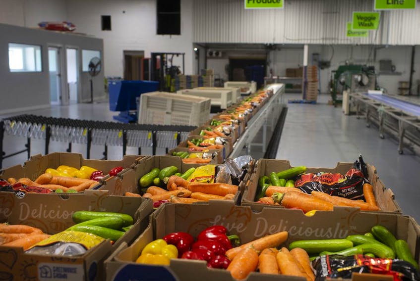 Fresh vegetables are packed into boxes and ready for shipment inside the newly unveiled Leamington Regional Food Hub, on Thursday, August 12, 2021.