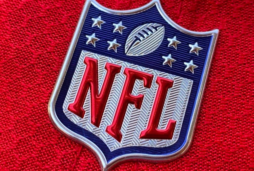 In this file photo the official NFL logo is seen on the back of a hat in Los Angeles on July 21, 2020. 