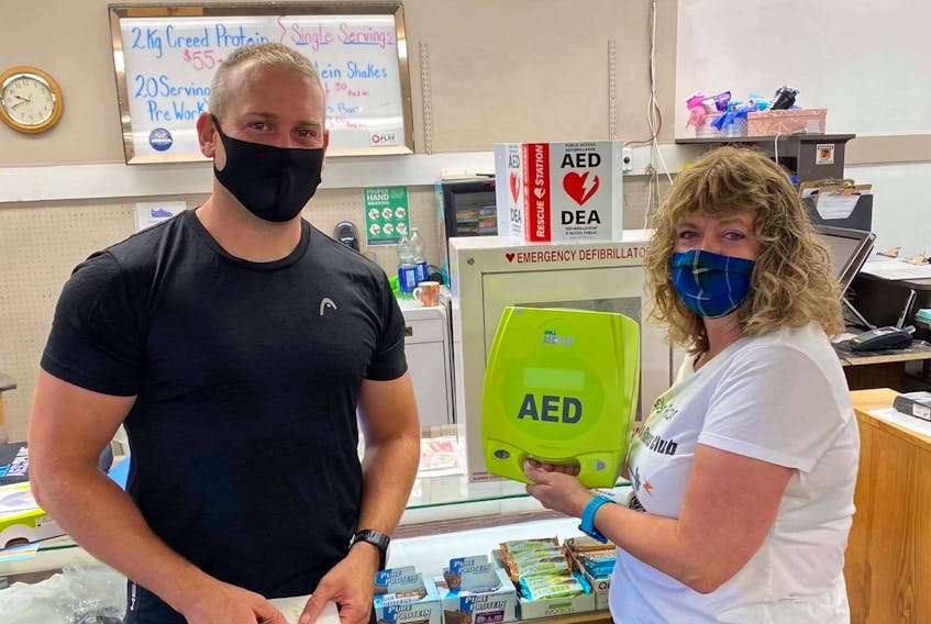 Advanced care paramedic Joel Connolly fundraised for an AED for the Locker Room Health and Fitness Club in Windsor. He presented the $1,650 device to owner Janice Forand on Sept. 1.