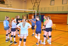 Kensington Intermediate-Senior High School (KISH) head coach Richard Younker discusses a drill with the senior AAA girls' volleyball team at a recent practice. The 46th edition of the KISH Volleyball Extravaganza is scheduled for this weekend. Play is to begin on Sept. 17 at 5 p.m., with the championship match set for Sept. 18 at 4 p.m.