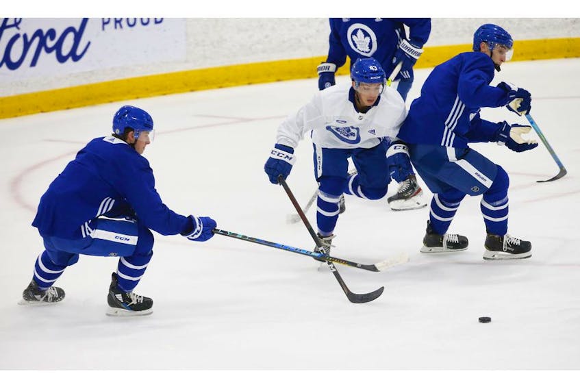 Toronto Maple Leafs forward Brett Seen (43) cuts past Mitch Marner (16) (left)  on the  ice at their practice facility in Etobicoke on Wednesday September 15, 2021. Jack Boland/Toronto Sun/Postmedia Network