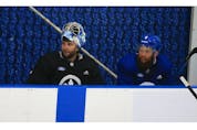 Toronto Maple Leafs goalie Jack Campbell on the bench with defenceman Justin Holl (8 - right)   at their practice facility in Etobicoke on Wednesday September 15, 2021. Jack Boland/Toronto Sun/Postmedia Network