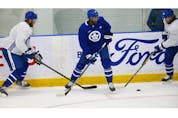 Toronto Maple Leafs forward Wayne Simmonds (24) caught in the middle  on the  ice at their practice facility in Etobicoke on Wednesday September 15, 2021. Jack Boland/Toronto Sun/Postmedia Network