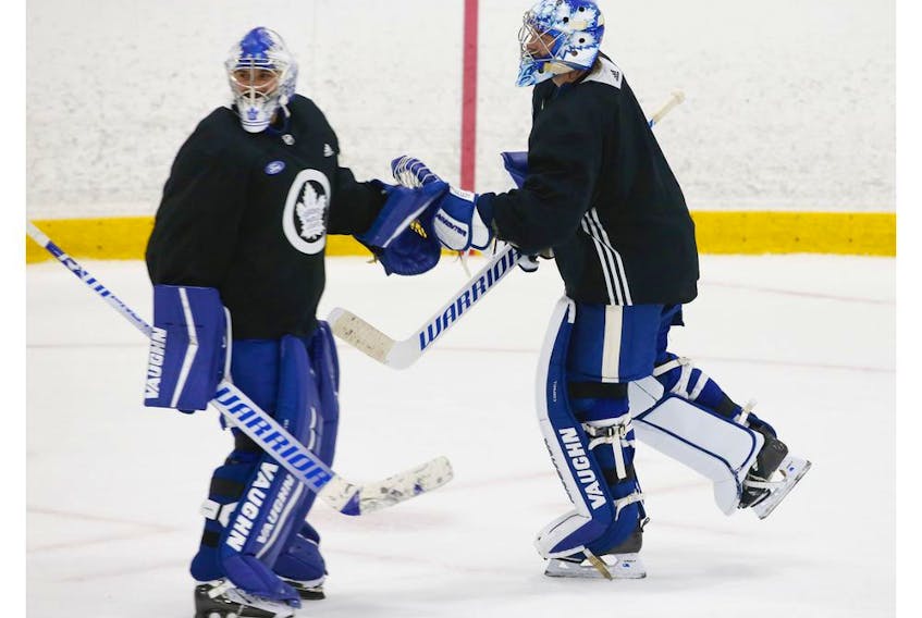 Toronto Maple Leafs goalie tandem of Petr Mrazek (left) and Jack Campbell switch off the ice during a scrimmage at their practice facility in Etobicoke on Wednesday September 15, 2021. Jack Boland/Toronto Sun/Postmedia Network
