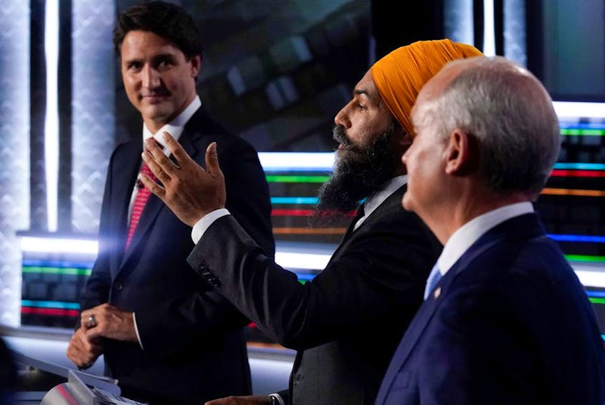 Liberal leader Justin Trudeau, left to right, NDP leader Jagmeet Singh, and Conservative leader Erin O'Toole take part in the federal election English-language leaders debate in Gatineau. 
