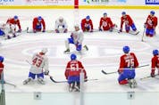 Players stretch during first day of Montreal Canadiens' rookie camp at the Bell Sports Complex in Brossard on Thursday, Sept. 16, 2021.