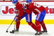 Mattias Norlinder, right, leans on Isiah Campbell during first day of Montreal Canadiens' rookie camp at the Bell Sports Complex in Brossard on Thursday, Sept.16, 2021. 