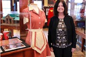  Irene Kerr, curator of the Highwood Museum, seen in 2015 with a display of Heartland memorabilia contained in the exhibit – On Location: Film in the Foothills. Fans of the TV show have helped keep the museum going with repeated visits.