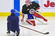 Montreal Canadiens goalie Carey Price does some exercises on the ice under the supervision of a member of the team's training staff at the Bell Sports Complex in Brossard on Thursday, Sept. 16, 2021.
