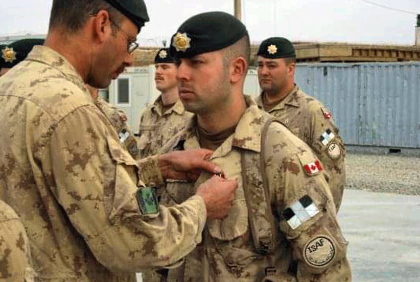 "It is still upsetting to think about, because you did have a connection there," Canadian veteran Matt Anderson (shown receiving pin) says of the collapse of Afghanistan's government to the Taliban.
